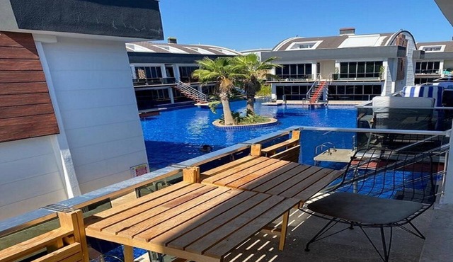 Flat closer to sea with big swimming pool .
